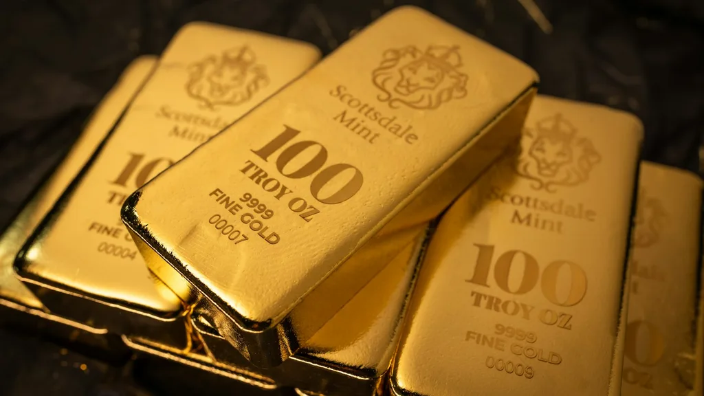 Barras de oro apiladas sobre una superficie oscura